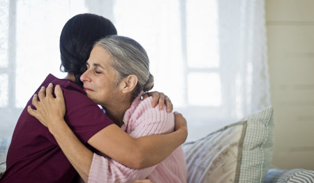 Picture of a nurse hugging a patient