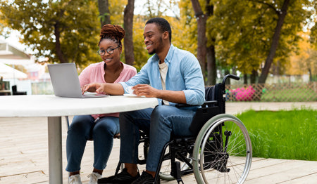 Picture of a two people with a laptop