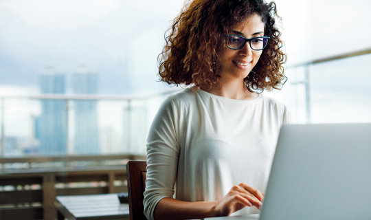 Woman working on laptop